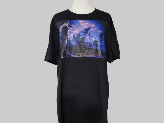 Black t-shirt with graphic design on a gray background