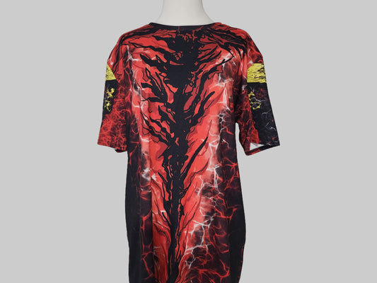 Red and black patterned dress on a mannequin against a gray background