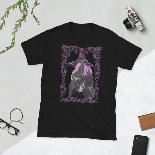 Black t-shirt with a purple graphic of a witch on a white surface with a camera and phone.