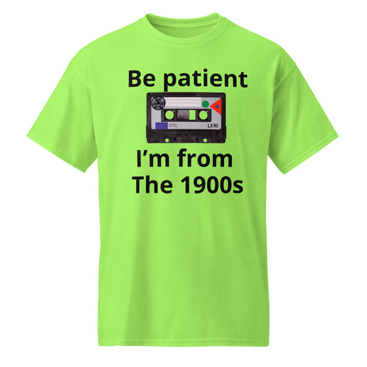 A bright lime green short-sleeve t-shirt with a graphic print on the front. The print features the text 'Be patient' above a retro cassette tape illustration, and 'I'm from The 1900s' below it.